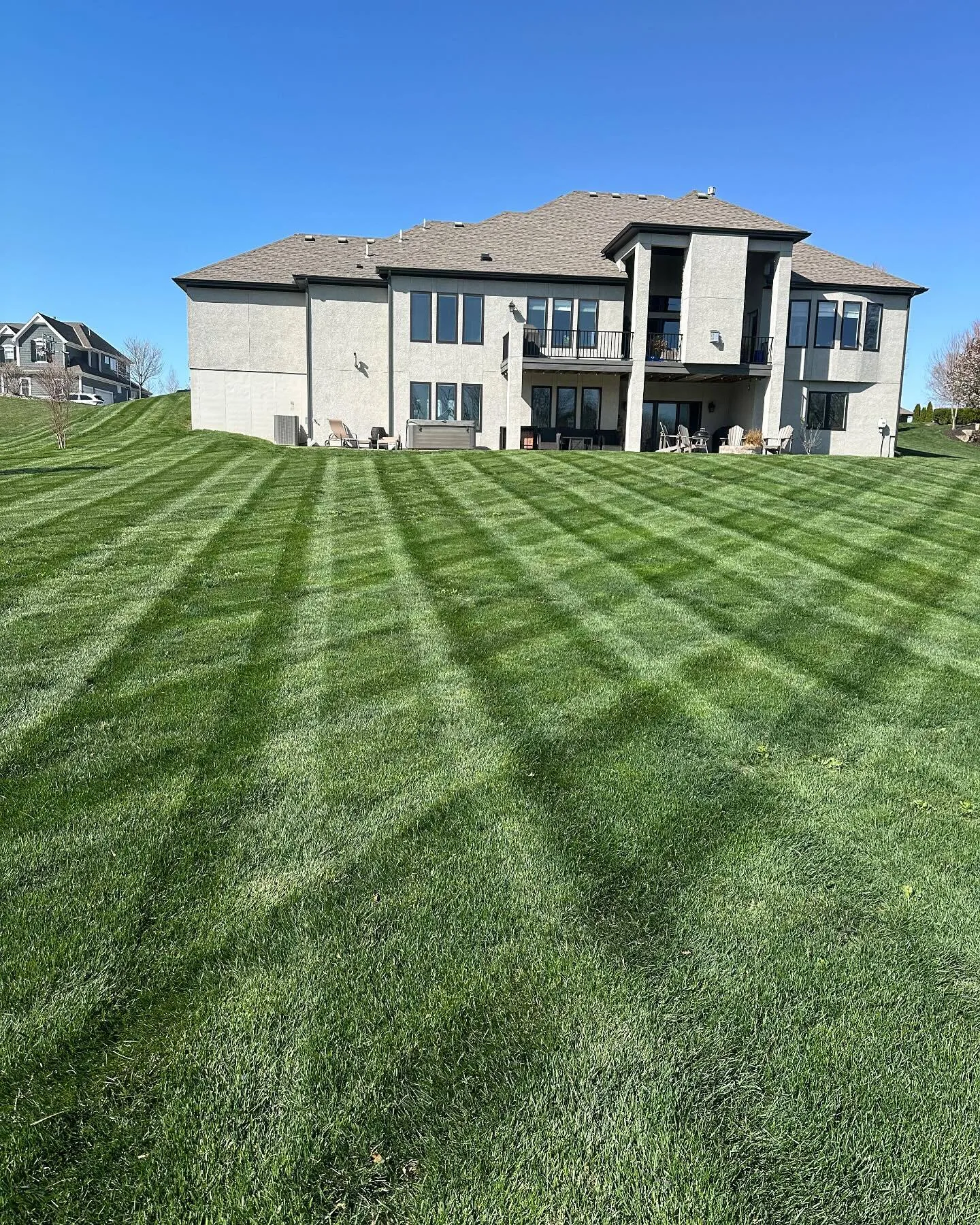 Precision crosshatch striping on residential lawn in Kansas City metro