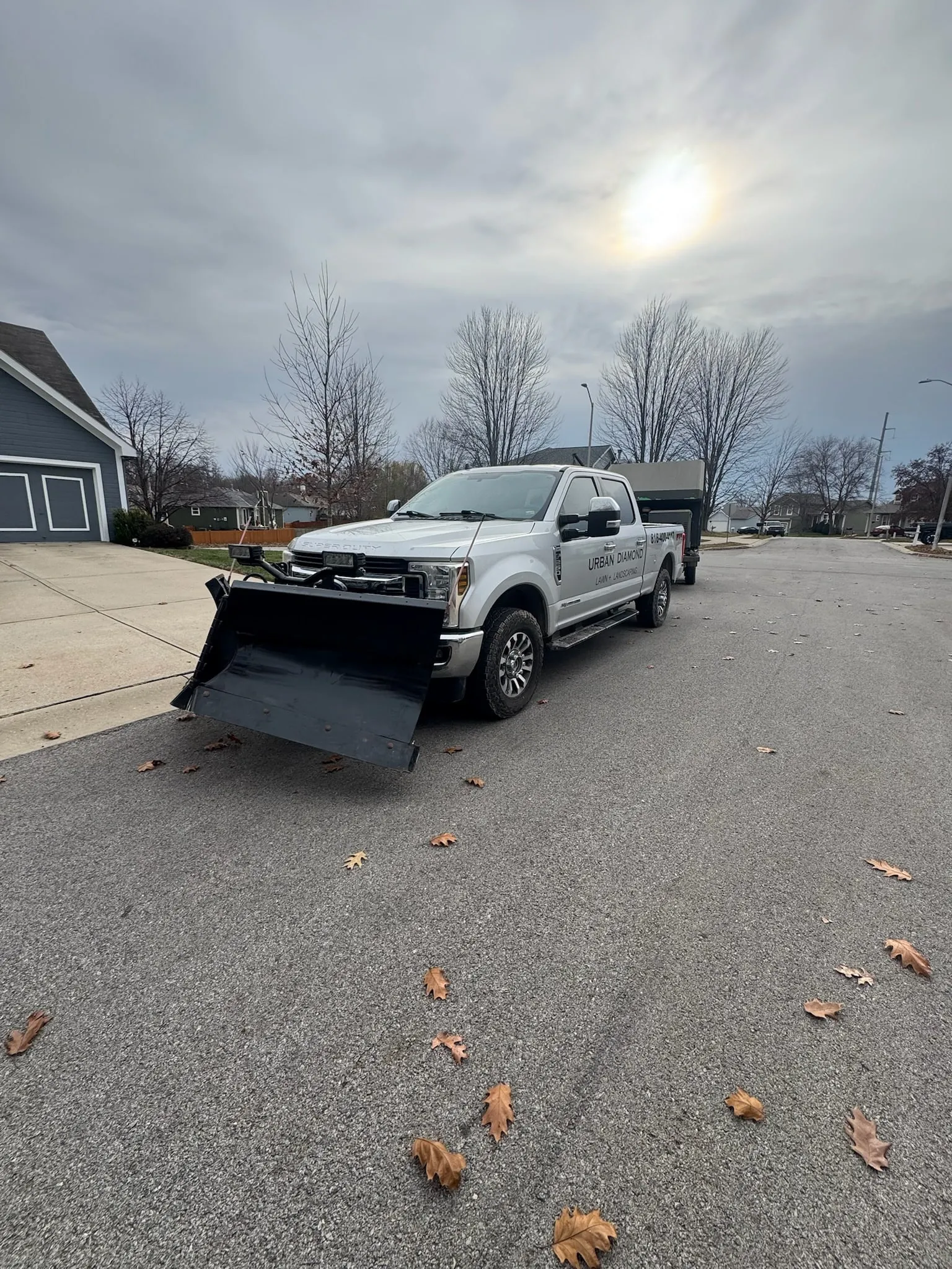 Urban Diamond Lawn + Landscaping branded plow truck staged and ready between storms
