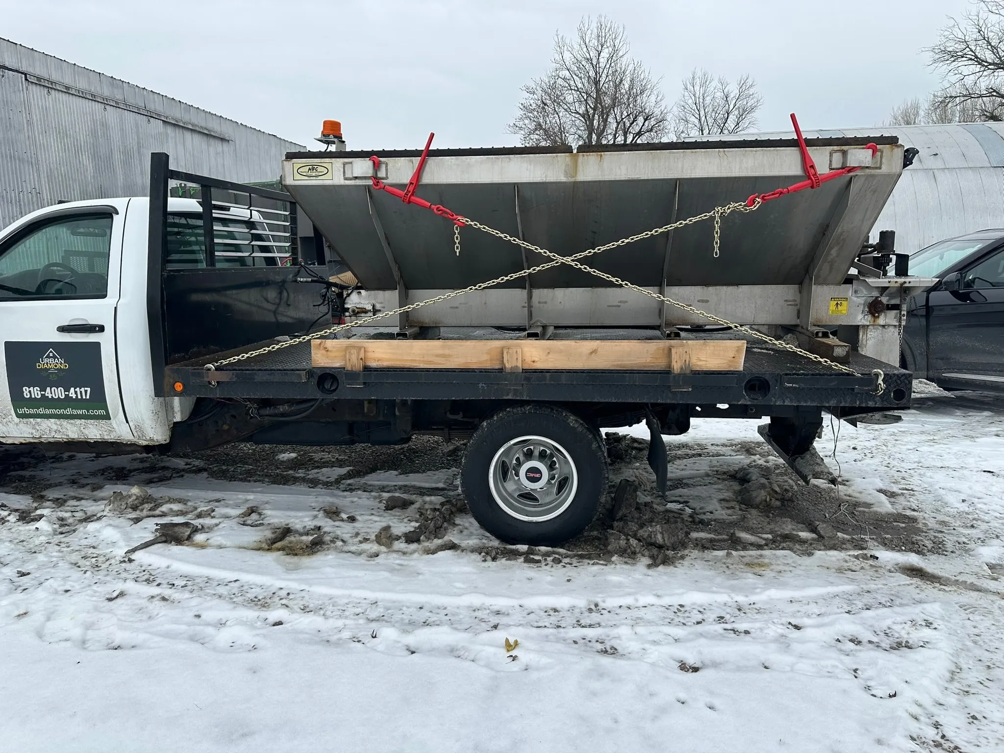 Urban Diamond branded flatbed truck with salt spreader attachment