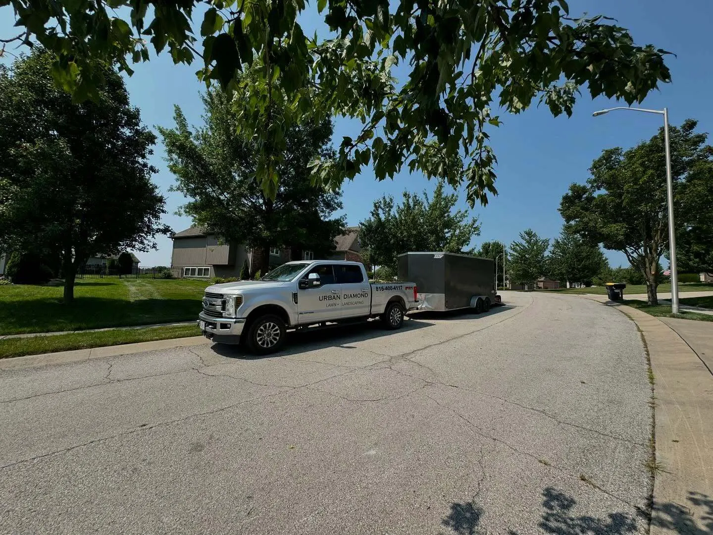 Urban Diamond service truck and enclosed trailer on route in the KC Northland