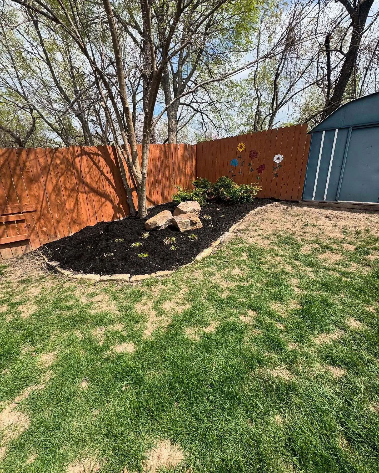 Landscape bed refresh with new mulch and trimmed edges