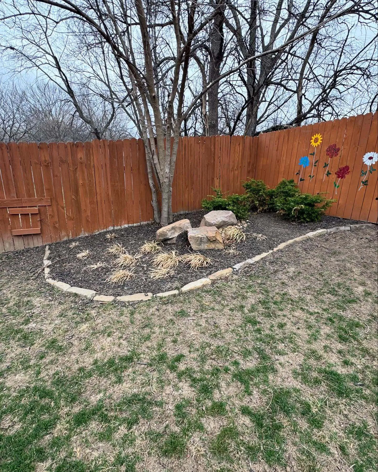 Professional mulch installation around Kansas City home landscaping