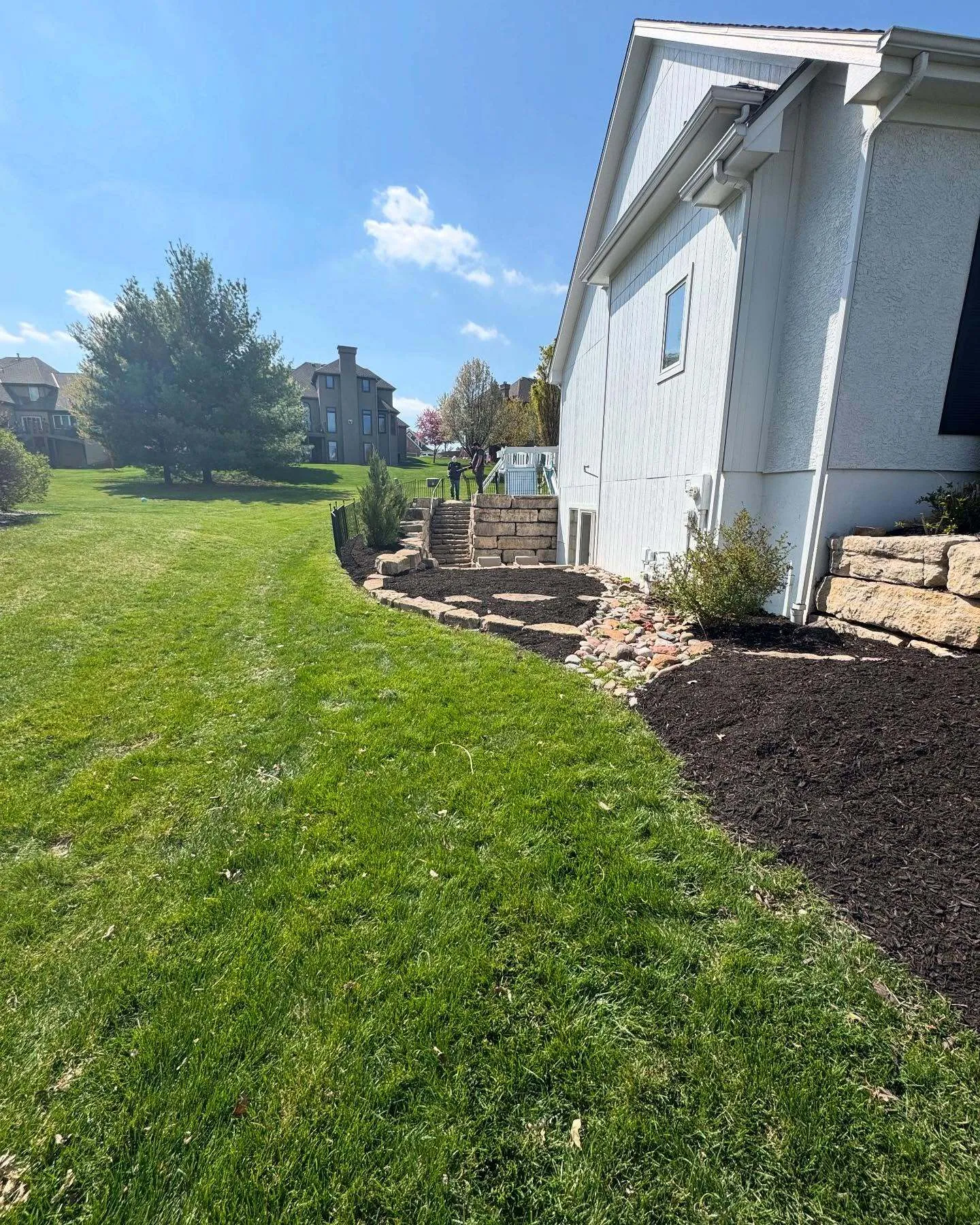 Mulch bed with well-maintained shrubs and plantings