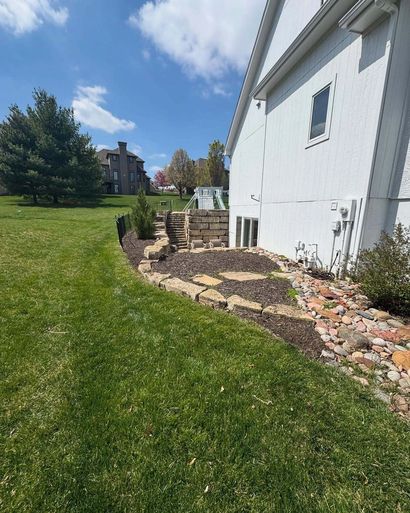Landscaped garden with stone edging in KC Northland